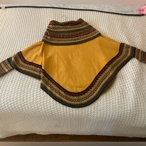 Peruvian multi colored poncho with sleeves one size fits all. New without tags